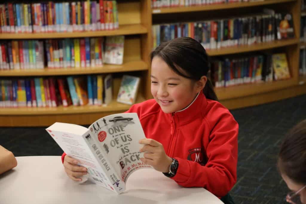 Girl reading in the school library