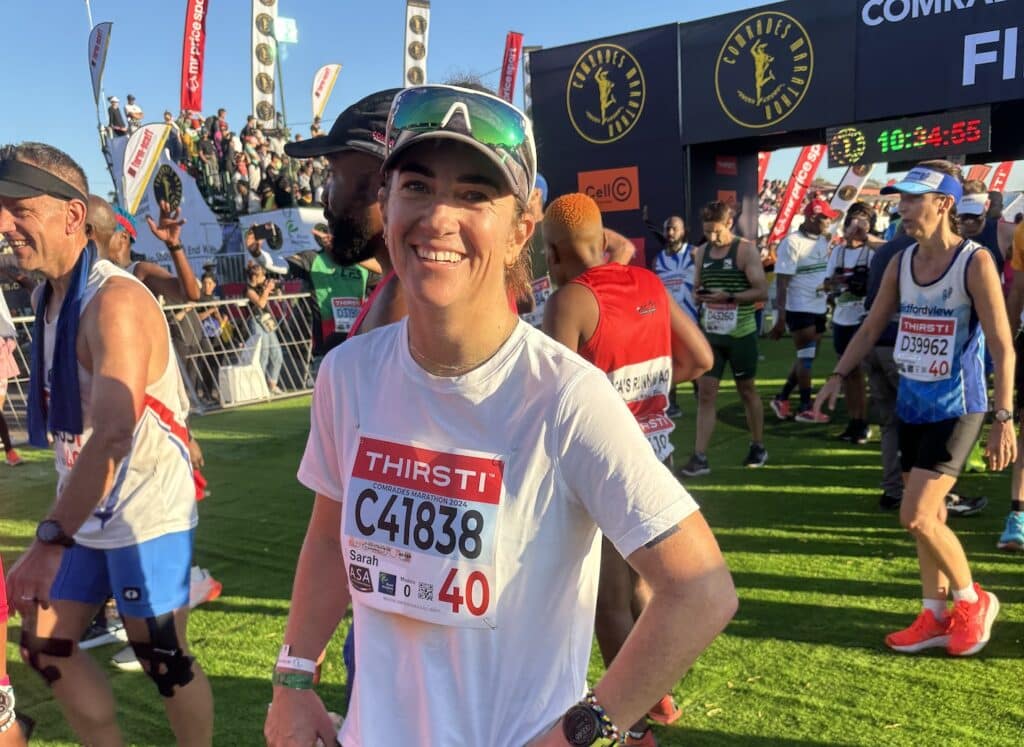 Sarah Thompson completing the Comrades Ultra Marathon, a challenging ultra marathon event known for its rich history and demanding course.